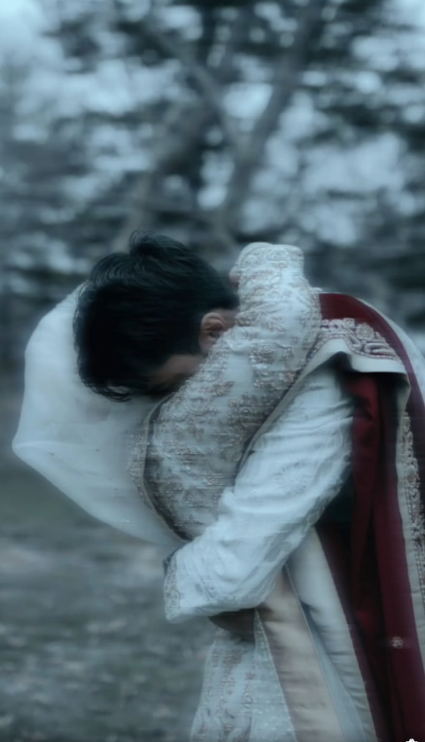 A couple embracing in wedding clothes